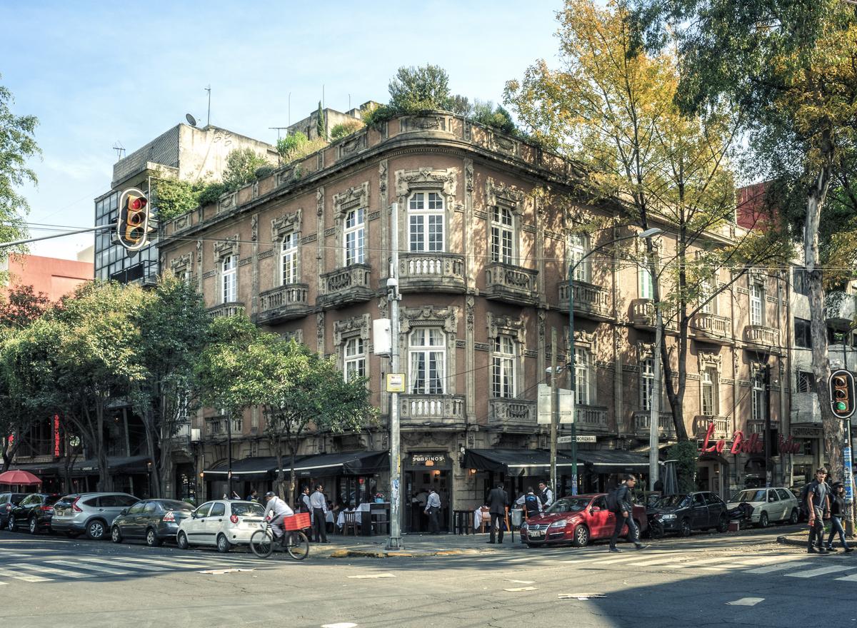 A Porfirian corner building above the cafés of Roma Norte, Mexico City